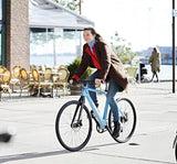 Woman in Denmark Riding Blue Coh & Co Erik Urban Downtown (6670778630195)