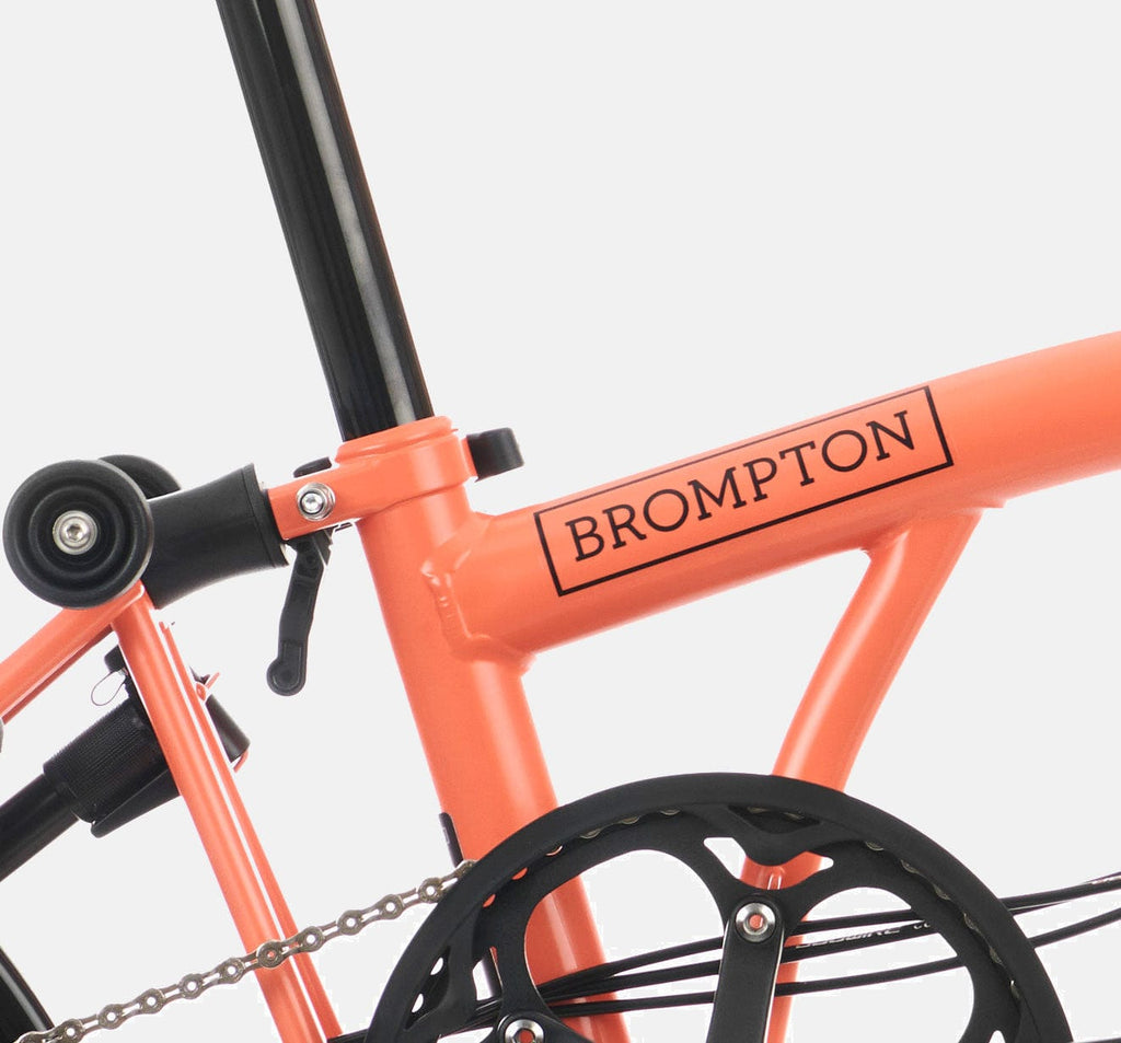 2023 Brompton C Line Explore Mid Handlebar 6-speed folding bike in Fire Coral - steel frame