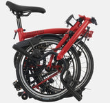 2023 Brompton C Line Explore Mid Handlebar 6-speed folding bike in House Red - folded