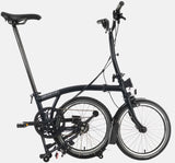2023 Brompton C Line Explore Mid Handlebar 6 speed folding bike in Black Matt - kickstand mode